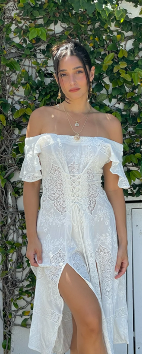 A woman wearing Vanessa Mooney the claudette dress - white crepe