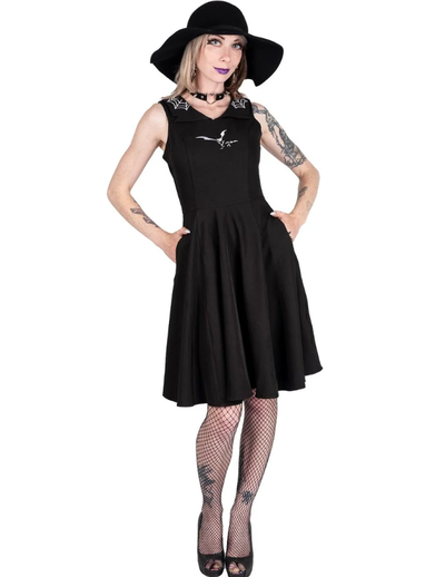 A woman wearing Too Fast orchid bloom | flying bats & web collar swing dress