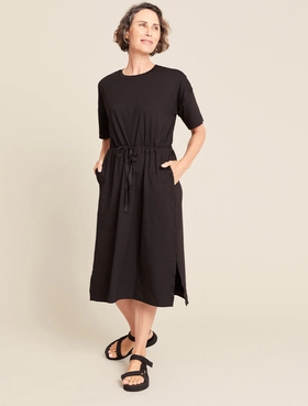 A woman wearing Boody black t-shirt tie dress