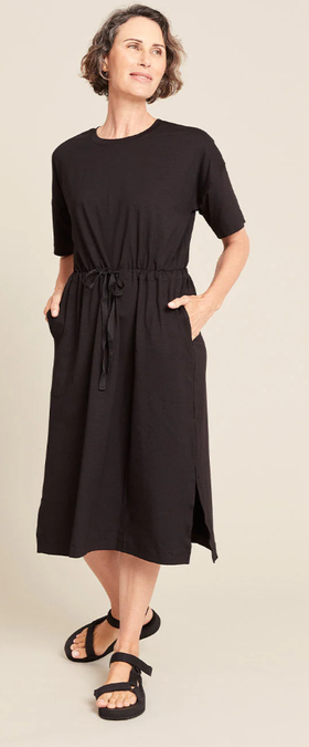 A woman wearing Boody black t-shirt tie dress