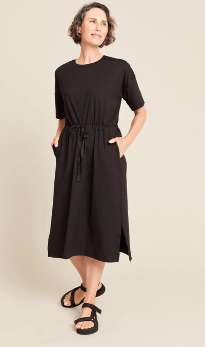 A woman wearing Boody black t-shirt tie dress