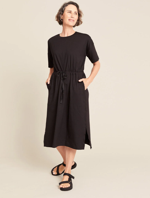 A woman wearing Boody black t-shirt tie dress