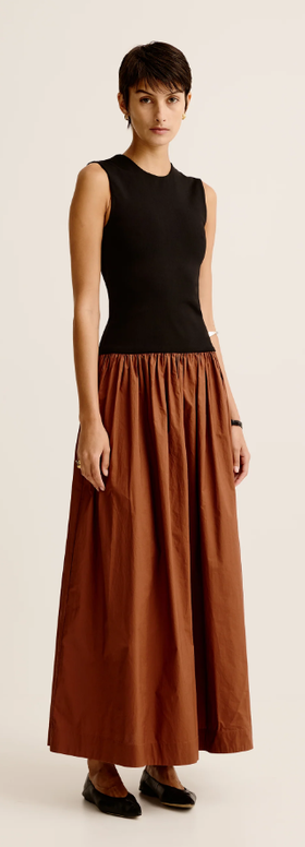 A woman wearing Esse Studios duo tank knit cotton dress - black / cinnamon