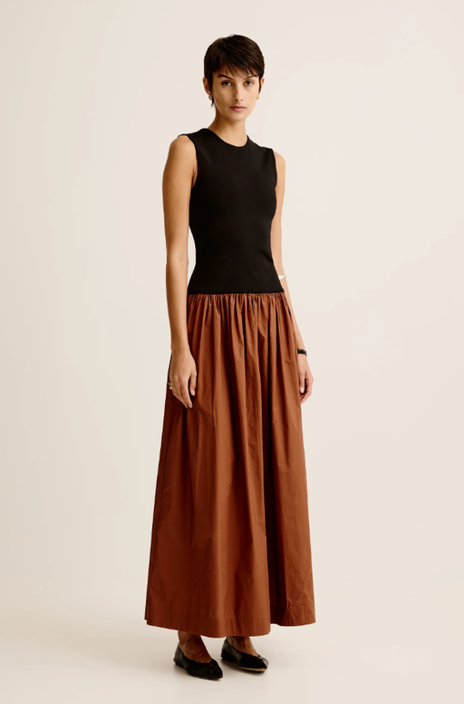 A woman wearing Esse Studios duo tank knit cotton dress - black / cinnamon