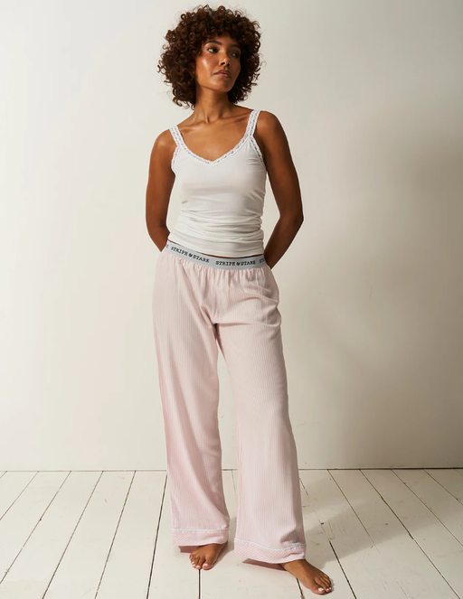 A woman wearing Stripe & Stare soft brushed woven pyjama bottoms