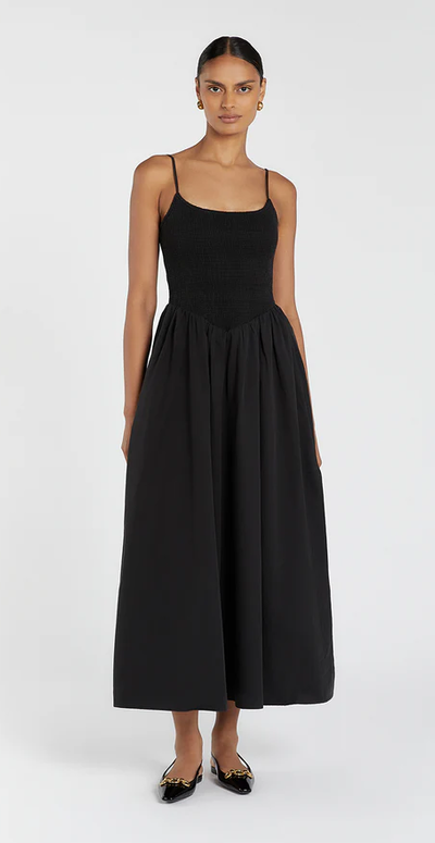 A woman wearing DISSH milano black cotton midi dress