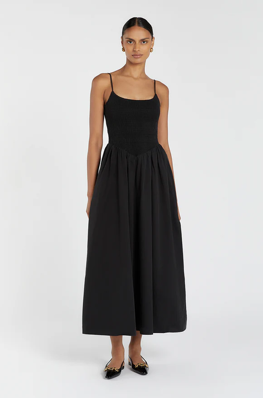 A woman wearing DISSH milano black cotton midi dress