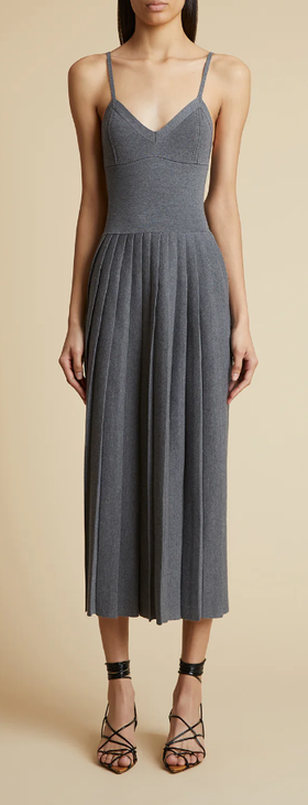 A woman wearing KHAITE elio dress in sterling