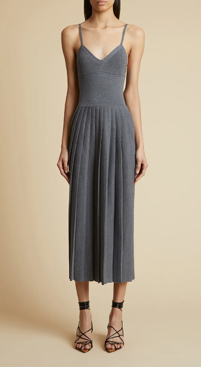 A woman wearing KHAITE elio dress in sterling