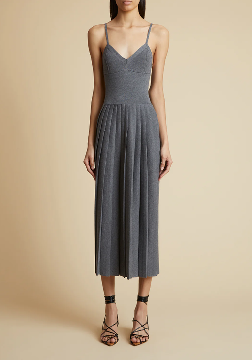 A woman wearing KHAITE elio dress in sterling