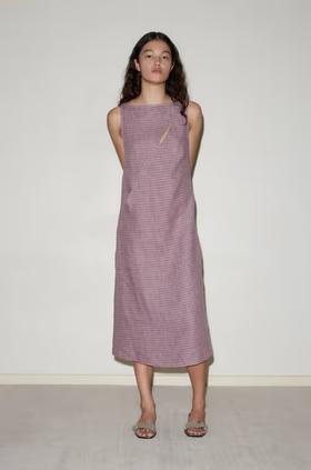 A woman wearing Deiji Studios high tie dress