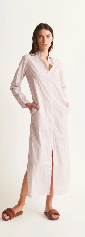 A woman wearing Skin red and white stripe selma dress