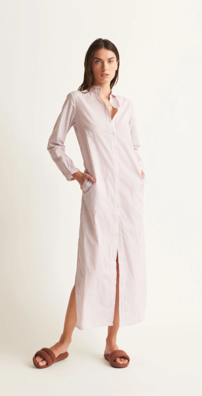 A woman wearing Skin red and white stripe selma dress