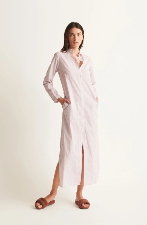 A woman wearing Skin red and white stripe selma dress