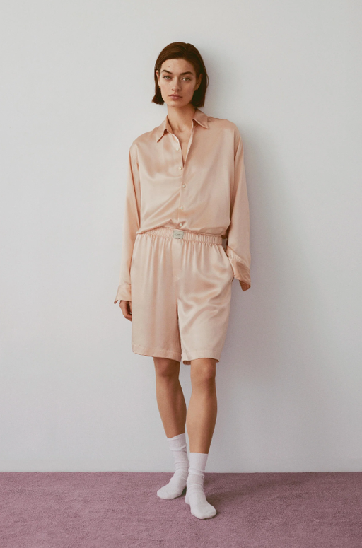 A woman wearing Comme Si la boxer bermuda