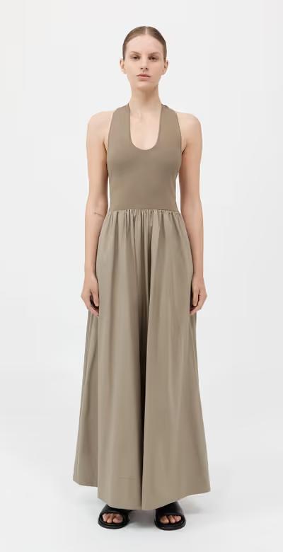 A woman wearing St. Agni plunge neck dress - shadow