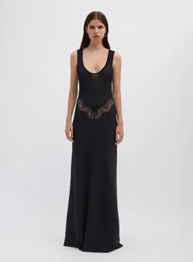 A woman wearing Christopher Esber black verna lace tank dress