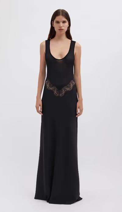 A woman wearing Christopher Esber black verna lace tank dress