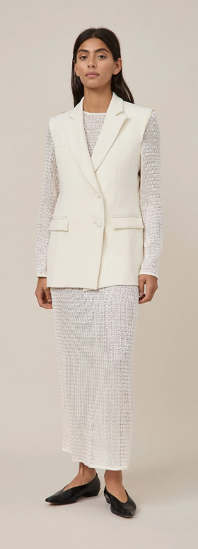 A woman wearing Maggie Marilyn white summertimes close dress