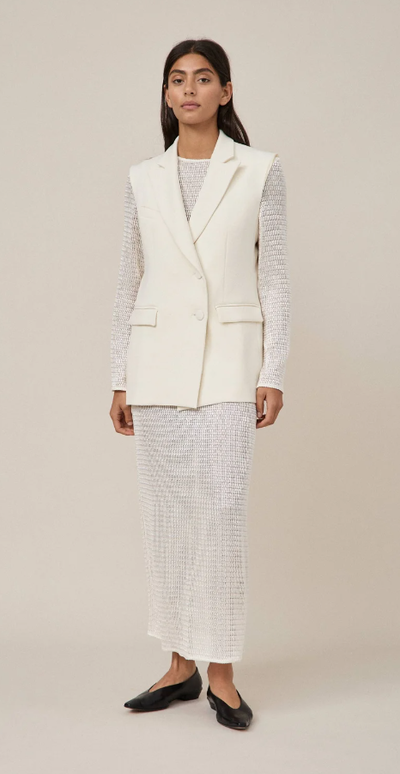 A woman wearing Maggie Marilyn white summertimes close dress
