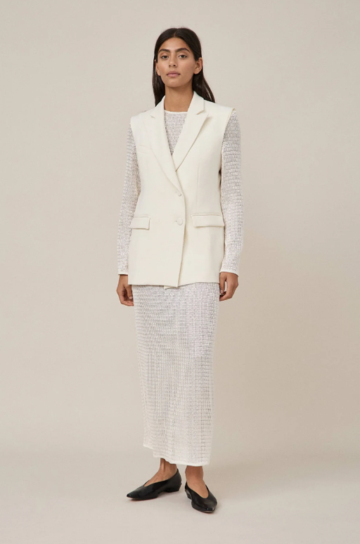 A woman wearing Maggie Marilyn white summertimes close dress