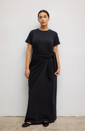 A woman wearing Leset black margo maxi dress