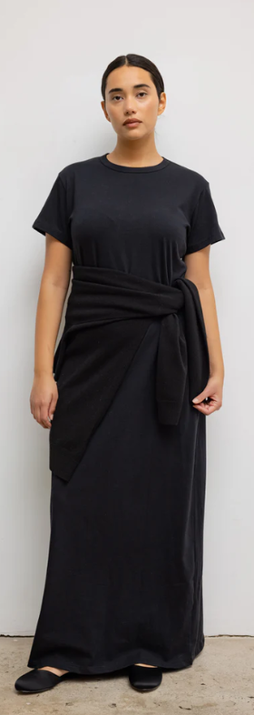 A woman wearing Leset black margo maxi dress