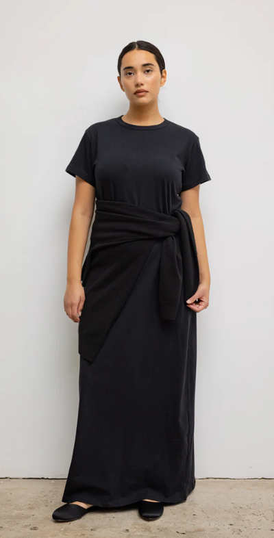 A woman wearing Leset black margo maxi dress