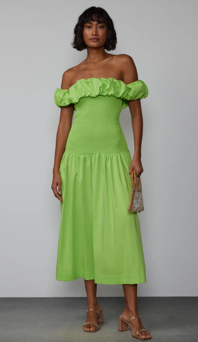 A woman wearing New York & Company off shoulder smock bodice midi dress