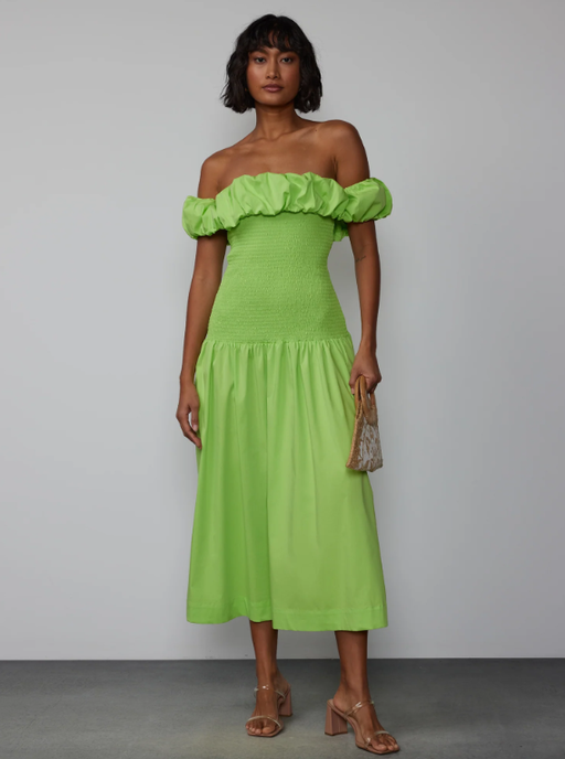 A woman wearing New York & Company off shoulder smock bodice midi dress