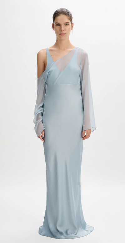 A woman wearing Beare Park bluebell color layered asymmetric dress