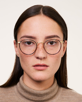A woman wearing Ace & Tate Neil eyeglasses