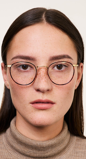 A woman wearing Ace & Tate Neil eyeglasses