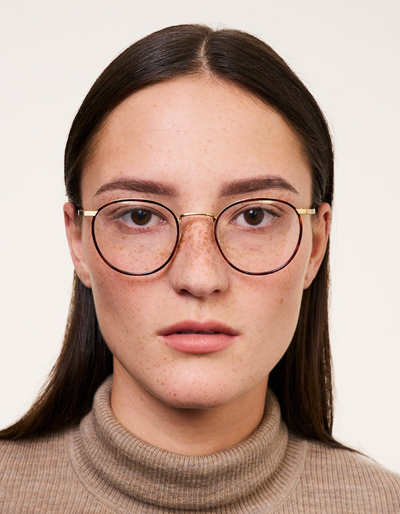 A woman wearing Ace & Tate Neil eyeglasses