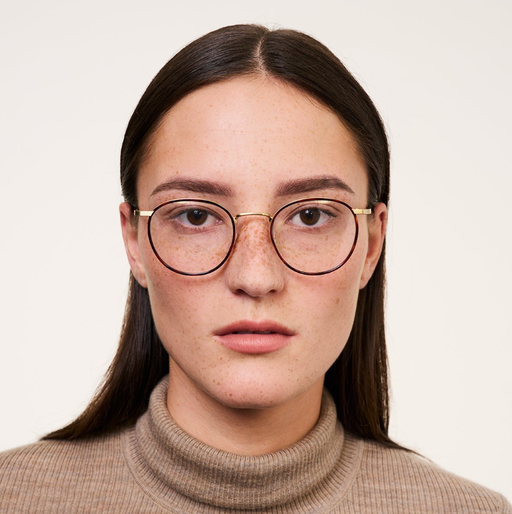 A woman wearing Ace & Tate Neil eyeglasses