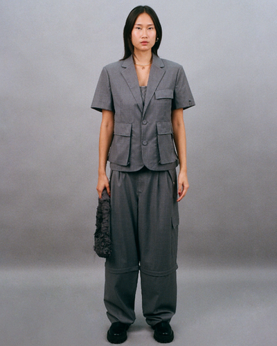 A woman wearing Bobblehaus bh zip-off wool suit pants