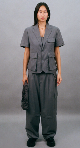A woman wearing Bobblehaus bh zip-off wool suit pants