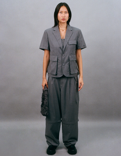 A woman wearing Bobblehaus bh zip-off wool suit pants