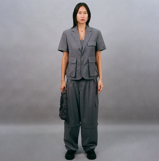 A woman wearing Bobblehaus bh zip-off wool suit pants