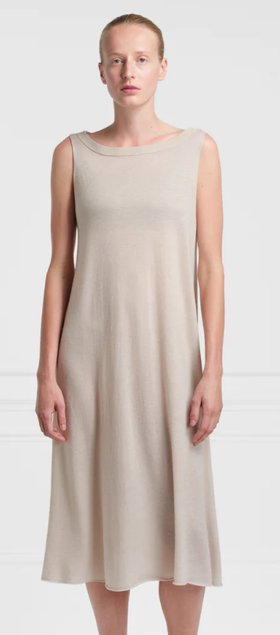 A woman wearing Extreme Cashmere lightweight 100% cashmere dress n°364 mia