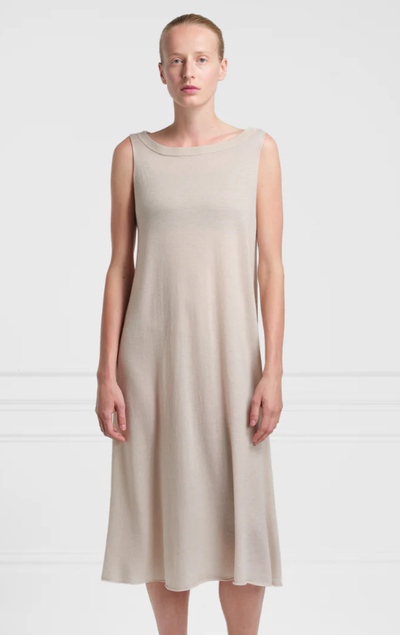 A woman wearing Extreme Cashmere lightweight 100% cashmere dress n°364 mia