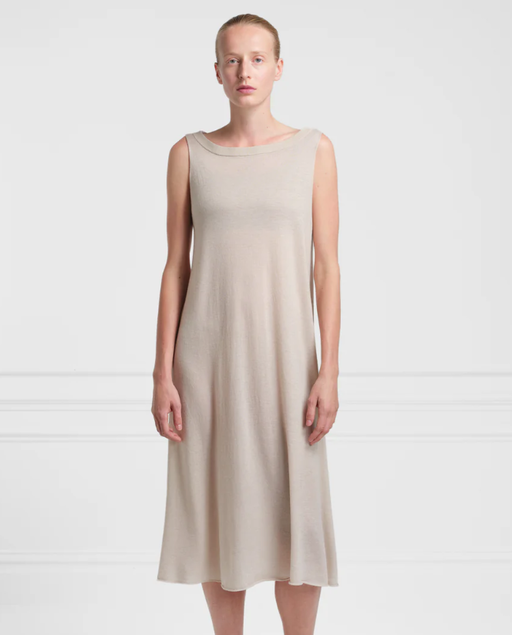 A woman wearing Extreme Cashmere lightweight 100% cashmere dress n°364 mia