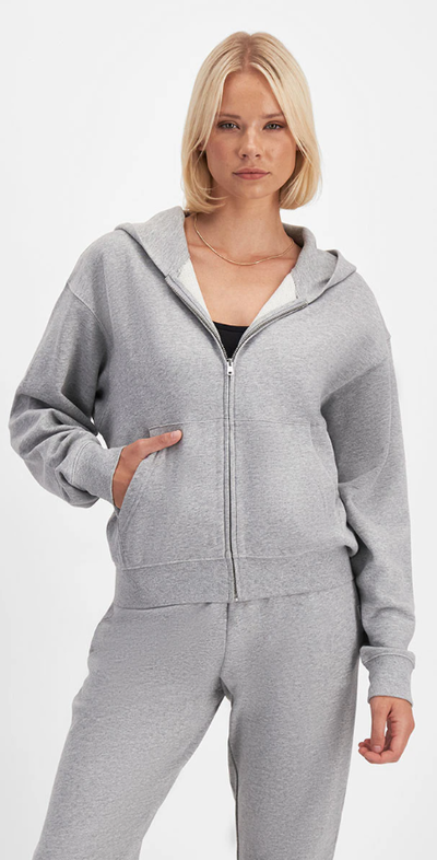 A woman wearing Bonds sweats cotton zip hoodie