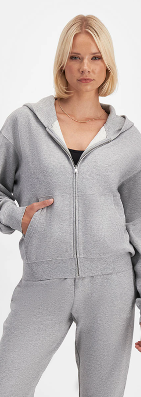 A woman wearing Bonds sweats cotton zip hoodie