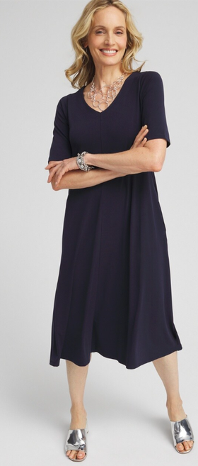 A woman wearing Chico's classic navy v-neck midi dress