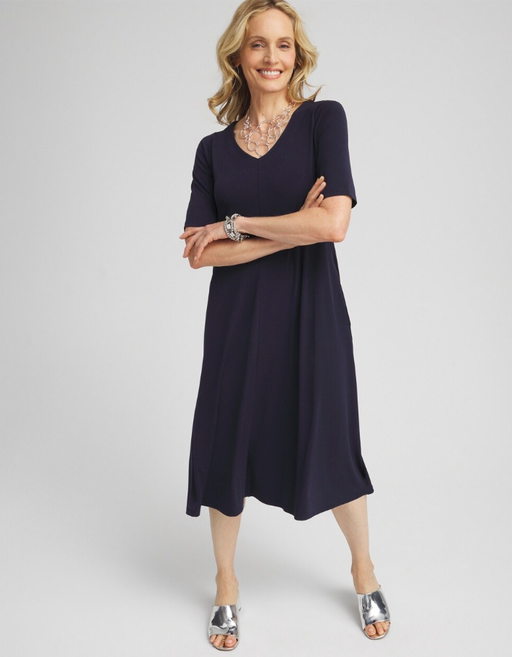 A woman wearing Chico's classic navy v-neck midi dress
