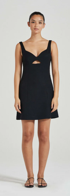 A woman wearing Friends with Frank black the xanthe mini dress