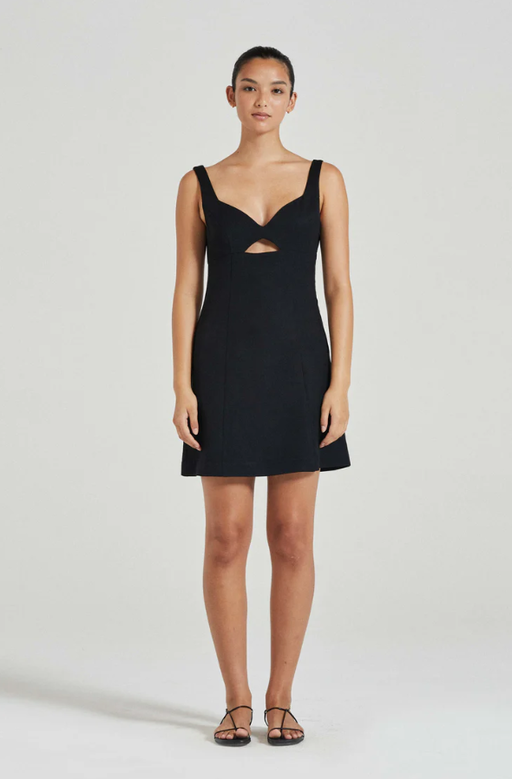 A woman wearing Friends with Frank black the xanthe mini dress