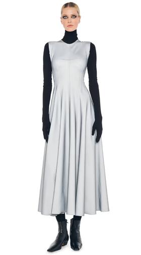 A woman wearing Norma Kamali grey sleeveless long grace dress