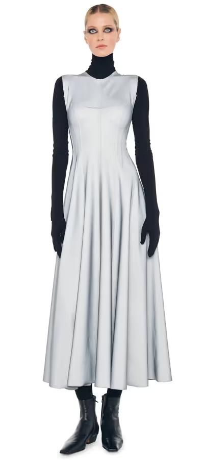 A woman wearing Norma Kamali grey sleeveless long grace dress
